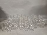 a lot of empty wine glasses sitting on a table