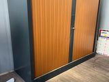 an image of an office cubicle with a wooden door
