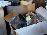 a pile of junk in a room with a lot of boxes on the floor