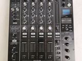 a close up of a dj controller on a white surface