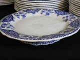 a stack of plates with blue and white designs on them