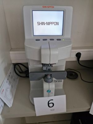 a machine that is sitting on a table with a sign in front of it