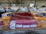 a lot of boxes of luggage wrapped in plastic