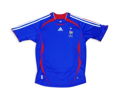 a blue shirt with a red and white stripe on the chest
