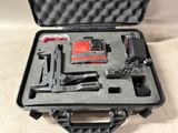 a black case with a gun and other items in it