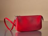 an image of a red purse on a table