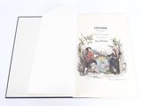 un livre ouvert avec la photo d'un homme et d'une femme assis sur un banc