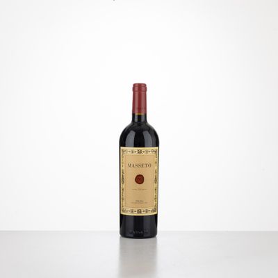 a bottle of red wine sitting on top of a table