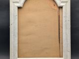 an old picture frame with a picture in it on a black background