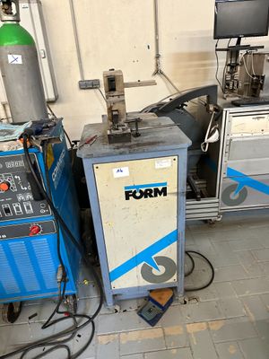two machines that are sitting next to each other in a room