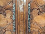 a large wooden door with ornate designs on it