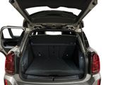 the back of a silver car with its trunk open on a white background