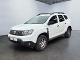 white dacia pick up truck parked in a large room
