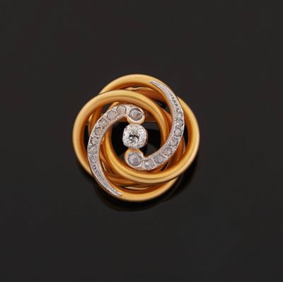 an 18k yellow gold and diamond broochle