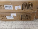 two boxes with a barcode on them sitting on the floor
