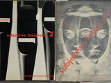 three books with black and white covers on them sitting on top of a table