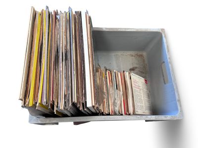 a box full of old records sitting on a table