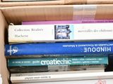 a box full of books sitting on top of a table