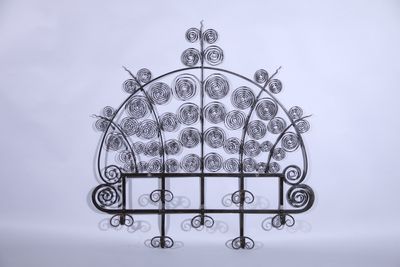 wrought iron garden trellis with flowers and vines