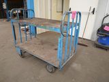 a blue cart that is sitting in a garage