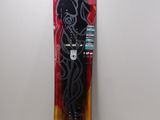 a snowboard that is hanging on a wall next to a lamp