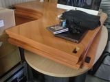 a laptop computer sitting on top of a wooden desk