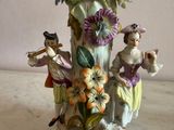 two figurines that are sitting on a table