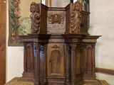 a small wooden table with a mirror on top of it