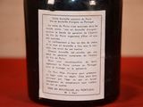a bottle of wine with a label on it on a table