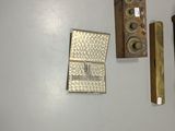 a clock on the wall next to a wall mounted telephone