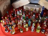 many bottles of alcohol sitting on a red table