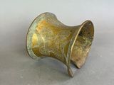 pair of antique brass napkin rings on a white background