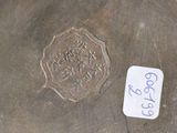 an image of a piece of metal with a sticker on it