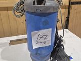 an image of a blue and gray water filterer on a table