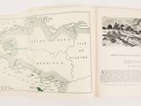 an open book with a map on it on a table