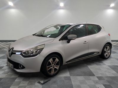 the white car is parked on a checkered tile floor
