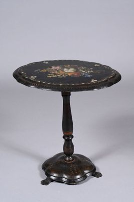 a black table with a floral design on it