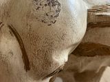 an elephant statue sitting on a table in a room