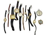 several different types of watches are arranged on a white surface