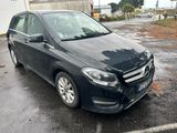 the mercedes b - class is parked in a parking lot in the rain
