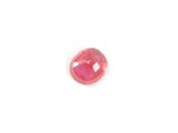 a pink faceted stone with a hole cut in the middle