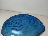 an image of a blue bowl sitting on top of a white counter