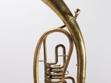 an old brass tuba is shown against a white background