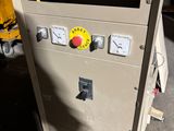 a machine that is sitting on the floor in the garage