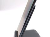 a cell phone that is sitting on top of a stand