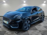 a black ford fiesta parked in a showroom with a checkered floor