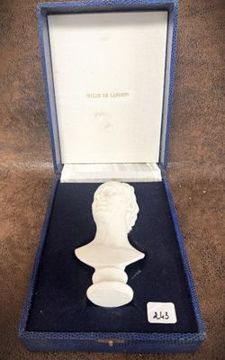 an image of a bust of a man in a box