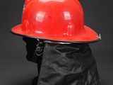 a red hard hat on a black background