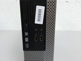 a dell desktop computer sitting on top of a white table