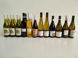 many bottles of wine lined up on the table